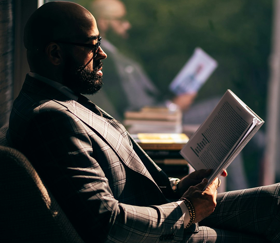 Professional businessman reading and analyzing documents